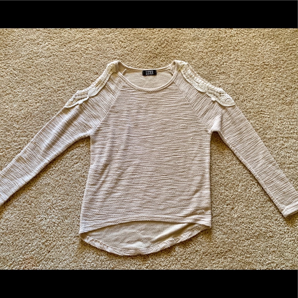 Sweater with open shoulder
